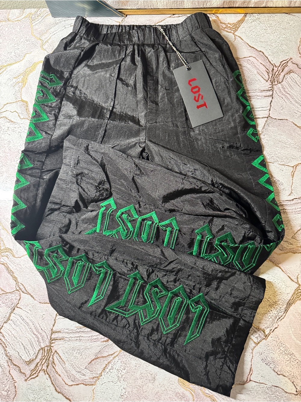 LOST Kids Black Joggers with Green Logo Trim